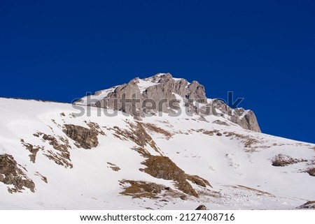Mountain panorama with mount Wissberg at the Swiss Alps seen from ski resort Engelberg Fürenalp, focus on background. Photo taken February 9th, 2022, Engelberg, Switzerland. Royalty-Free Stock Photo #2127408716
