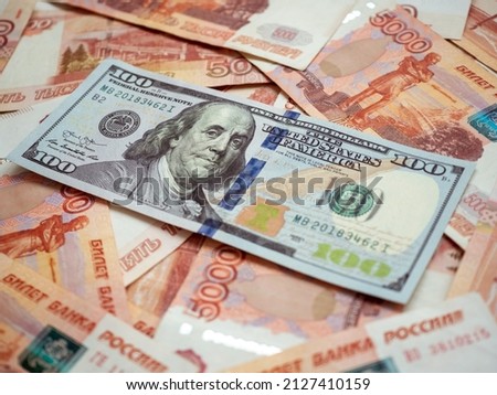 US Dollar and Russian ruble. Money background. Currency exhange. Economic crisis. Rouble dollar cash. Hundred dollar bill and 5000 rubles. Business and finance. Russia and USA Royalty-Free Stock Photo #2127410159