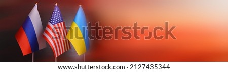 Flags of the USA, Russia, Ukraine on the background of fire. Relations between Ukraine and Russia, sanctions,concept of war mediated by the United States.Concept political conflicts between nations