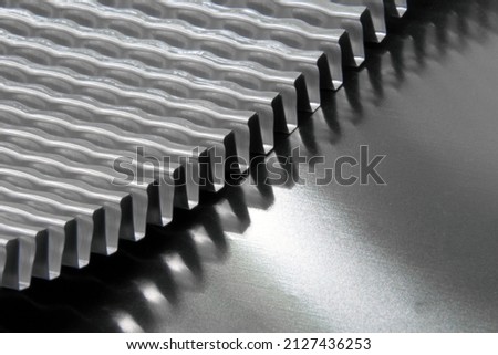 Corrugated metal. Macro close-up of steel or aluminum texture. 3d metal sheet in the shape of a wave.