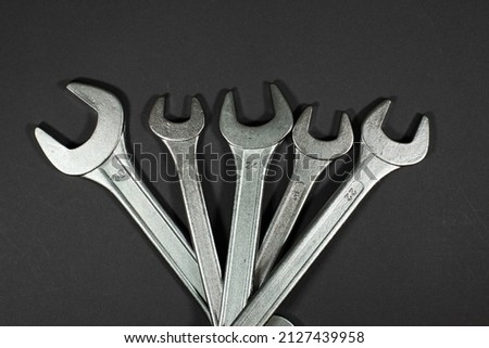 wrenches on a black background