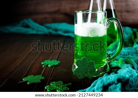 Green beer pint for Saint Patrick day on wooden table