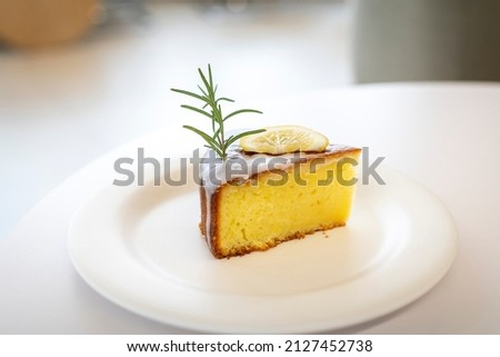 Lemon cake in a bowl. A dessert that goes well with a cup of coffee. A high-resolution picture. Out focus dessert picture.