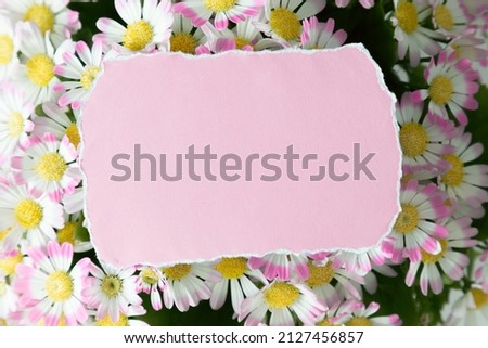 Blank pink card mockup with torn edges and flower bouquet. Valentines Day, Easter, Happy Women's Day, Mother's day. Flat lay, top view, copy space