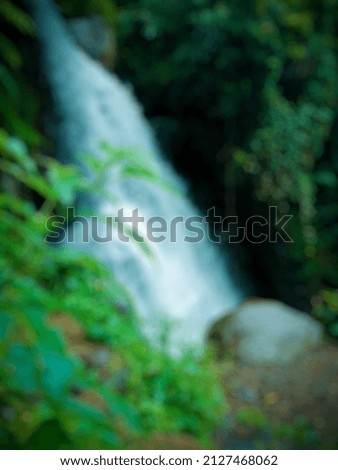 Defocused abstract background of water fall