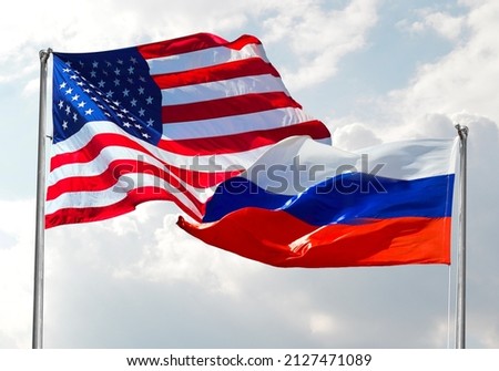 Usa Flag on Urss Russia Flag with clear sky in background