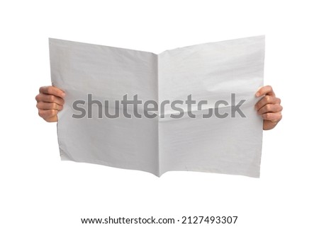 Blank newspaper holding hand. Using for mockup. Royalty-Free Stock Photo #2127493307