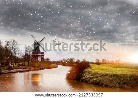 Twin mills of Greetsiel in East Frisia Royalty-Free Stock Photo #2127533957