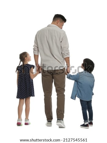 Children with their father on white background, back view Royalty-Free Stock Photo #2127545561