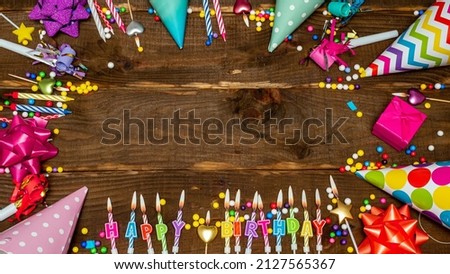 Top view, birthday decorations from letters of candles with fire, copy space. Happy birthday background