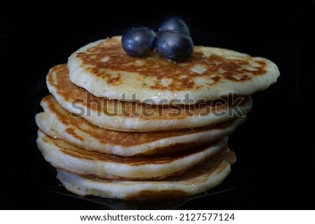           very tasty pancakes on black background                     