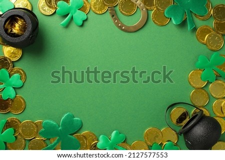 Top view photo of many golden coins two black pots with money inside bronze horseshoe and confetti in shape of clovers different size on the green isolated background copyspace