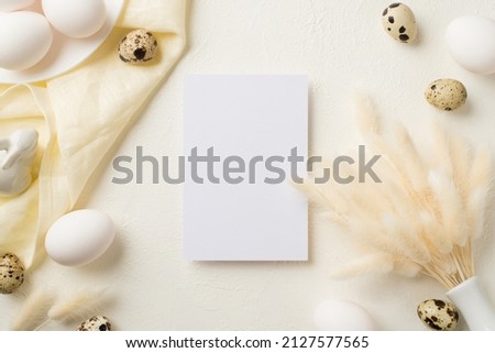Top view photo of easter decorations paper card white vase with lagurus flowers plate ceramic bunny easter eggs and cloth on isolated white background with blank space