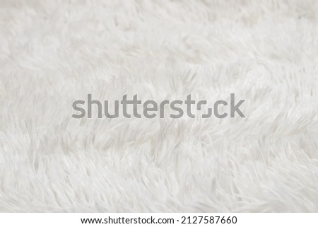 Synthetic fur white texture for the background.