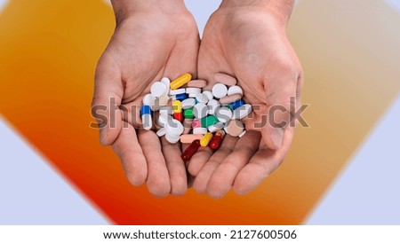 Doctor's hand holding a set of medical pill