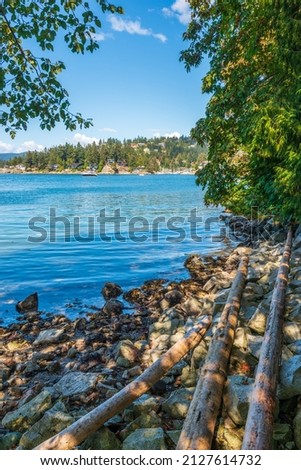 ocean view with mountains, blue sky and white clouds in slow motion at summer day in Vancouver, Canada
