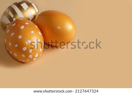 Easter composition with golden decorated eggs, abstract spring card, minimal happy holiday concept, background, banner for screen, template for design, selective focus