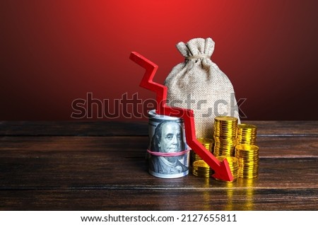 Money with red arrow down. Decreased funds and money. Fall of economy, capital reduction. Lowering in savings and reserves. Inflation. Falling income in GDP. Economic recession, crisis. Royalty-Free Stock Photo #2127655811