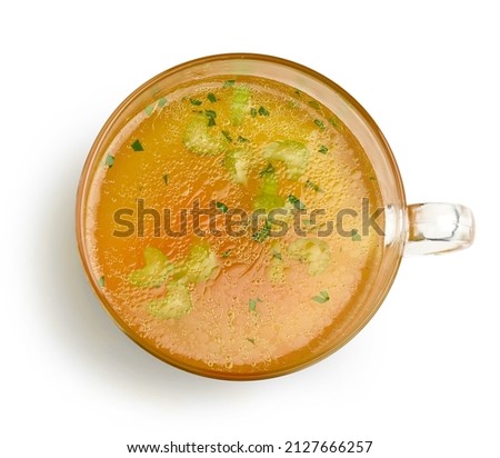 cup of fresh chicken broth isolated on white background, top view