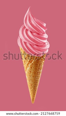 soft ice cream swirl in waffle cone isolated on pink background