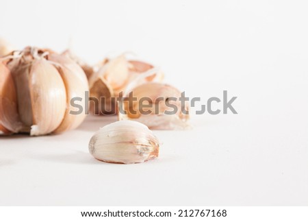 moldy garlic on white paper background