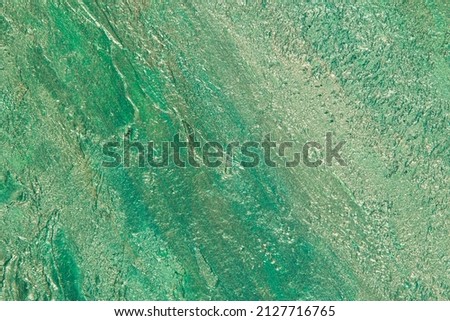 abstract background: textured plaster with emerald turquoise color, close 