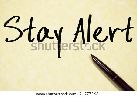 stay alert text write on paper 