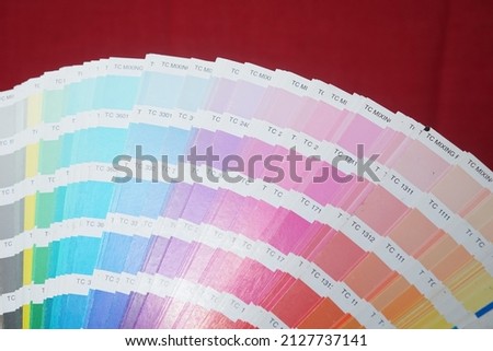 CMYK press color chart image on red background