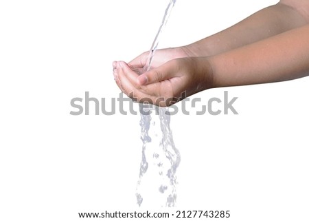 Muslim hands taking ablution before praying isolated over white background Royalty-Free Stock Photo #2127743285