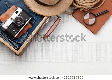 Travel and vacation concept. Luggage with trip items and clothes. Top view flat lay with copy space
