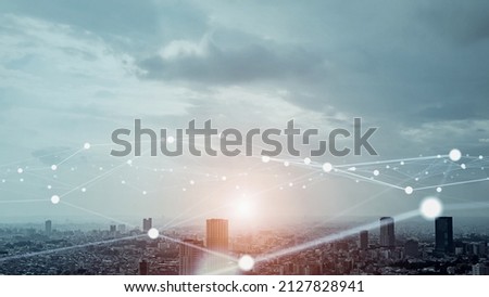 Modern cityscape and communication network concept. Telecommunication. IoT (Internet of Things). ICT (Information communication Technology). 5G. Smart city. Digital transformation. Royalty-Free Stock Photo #2127828941