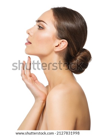Woman Face Profile. Perfect Women Nose Side view. Facial Model showing with Finger on Slim Chin and Neck. Facelift Massage and Plastic Surgery Concept over White isolated Royalty-Free Stock Photo #2127831998