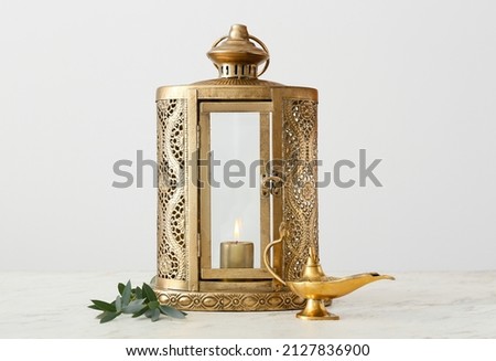 Muslim lamps on light background Royalty-Free Stock Photo #2127836900