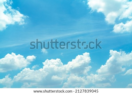 Beautiful blue sky and white cumulus clouds abstract background. Cloudscape background. Blue sky and fluffy white clouds on sunny day. Nature weather. Beautiful blue sky for happy day background.  Royalty-Free Stock Photo #2127839045