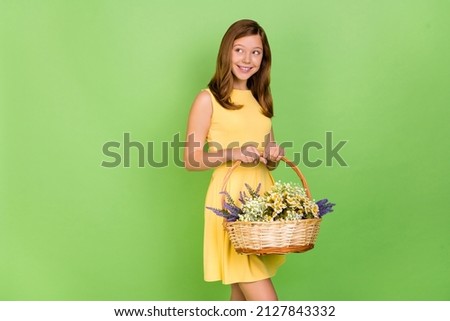 Photo of blone hair adorable girl look copyspace dreaming celebrate spring holidays isolated on green color background