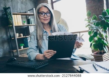 Photo of concentrated marketer lady sit table read daily schedule tips task secretary assistant prepare in workspace Royalty-Free Stock Photo #2127844088