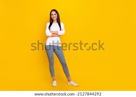 Full size photo of young pretty woman folded hands standing manager isolated over yellow color background