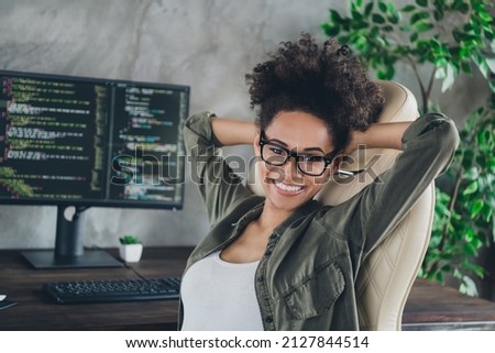 Photo of smart skilled lady freelancer sit desk resting after server optimization web development in modern workplace workstation