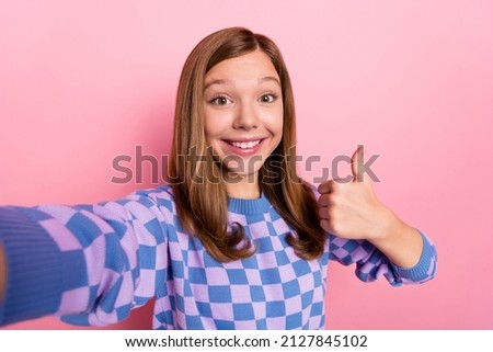 Photo of brown sweet small girl do selfie show okey sign wear plaid sweater isolated on pink color background