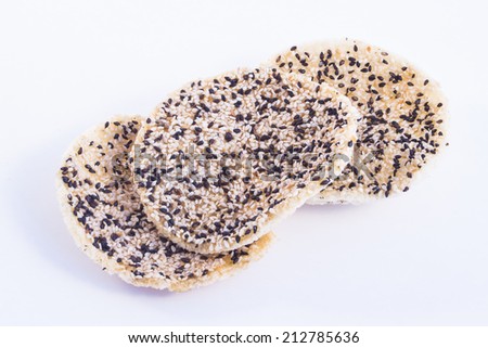 Rice cracker with sesame isolated on a white background