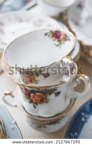 A vertical shot of a vintage English bone china crockery with a blurry background Royalty-Free Stock Photo #2127867290
