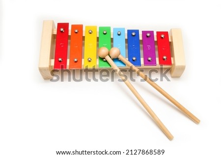 The basic xylophone for children to learn to play simple music. Isolated in a white background.  Royalty-Free Stock Photo #2127868589