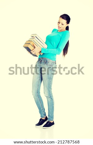 Student woman holding heavy books, isolated on white