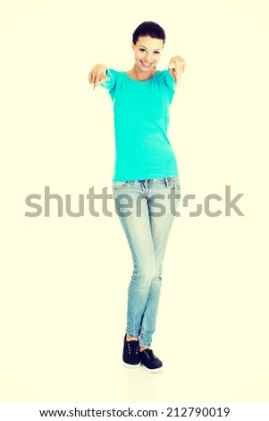 Young beautiful caucasian woman pointing on you ,isolated on white
