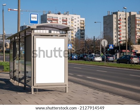 Empty blank white cut out bus stop advertisement poster, vertical ad banner sign board, city advert on the street, urban public space advertising placeholder simple template, daytime, nobody