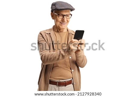 Happy elderly gentleman standing and using a smartphone isolated on white background