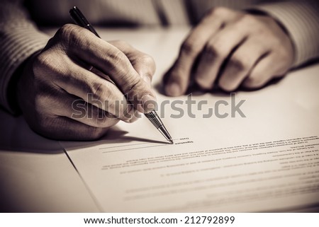 signing finance contract Royalty-Free Stock Photo #212792899