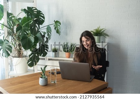 Young business woman psychotherapist doctor having online psychotherapy therapy with her patient on video call on the laptop computer while she working at home in the home office, telemedicine concept Royalty-Free Stock Photo #2127935564