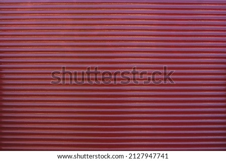 Brown window blinds rolling shutter. Abstract of stripe pattern of roller shutter doors or steel doors background. Metal texture surface. Industrial background. Modern concept. Copy space.