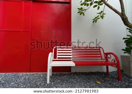 Contrash between white and red for the furniture, contemporary interior or exterior design concept